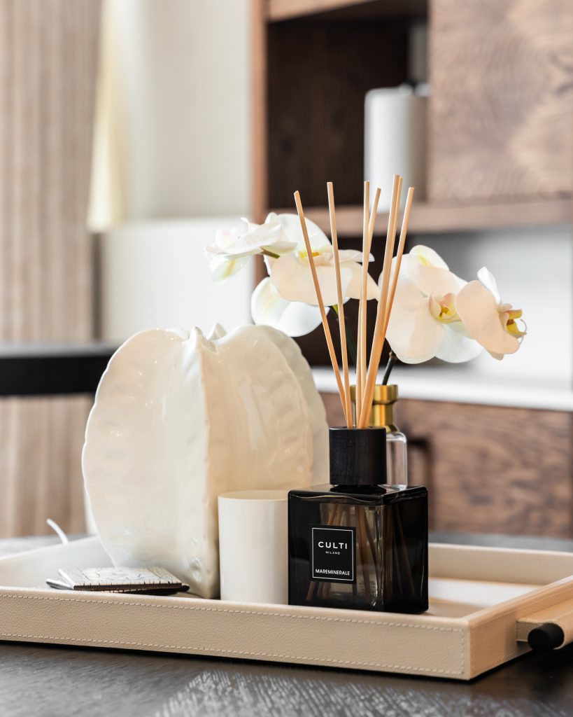 Culti diffusor and vase on a display tray on a finished design. 